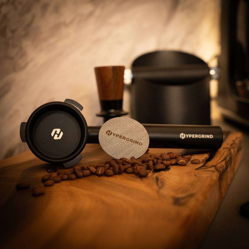 Breville 54mm Bottomless Portafilter (Black) and Puck Screens on Timber bench