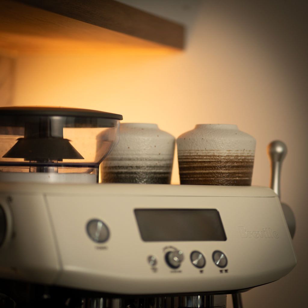 Ceramic Coffee Mugs Sitting On Breville Machine